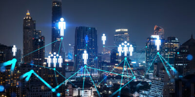 Glowing Social media icons on night panoramic city view of Bangkok, Asia. The concept of networking and establishing new connections between people and businesses. Double exposure.